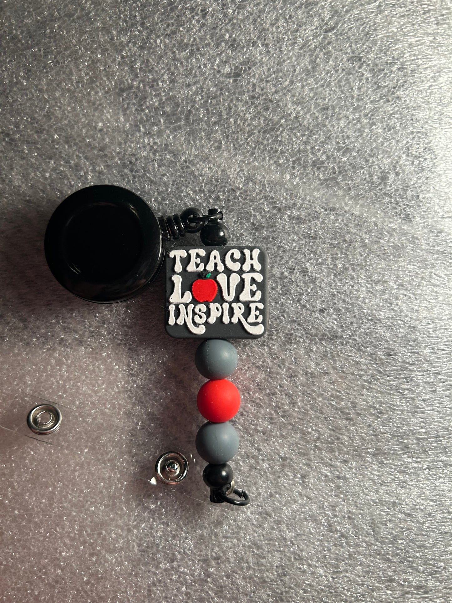 Teach love inspired – focal badge reel